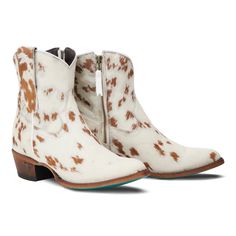 FINAL SALE! Cowpoke bootie by Lane is authentic hair on hide cowhide leather. No two are alike! Heirloom quality ankle boots with a western influence. The classic snip toe profile with cowhide leather features white black and or brown hair. The cow print and turquoise sole are a gorgeous combination. *NOTE: some boots are brown and white hair and others black and white hair. If you have a very strong preference, email me first to see what we have available in your size. Otherwise we send what is White Leather Boots For Western-themed Events, Western Style Booties For Rodeo In Fall, White Snip Toe Heeled Boots For Ranch, White Ankle Boots For Ranch, White Country Boots For Fall, Western Snip Toe Chelsea Boots For Ranch, Western Snip Toe Booties For Fall, Western Style Leather Sole Booties For Fall, Western Leather Booties With Snip Toe