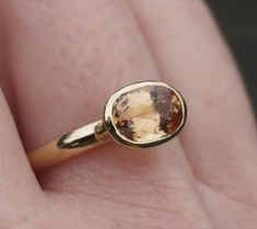 This is a one-off ring, a beautiful Imperial topaz set in 18ct recycled yellow gold. This particular stone has sold but we can get in some other options for you to choose from. An increasingly rare gem, most of the stock now just comes from Ouro Prêto in Brazil and very little is exported out of the country. It's colour ranges from yellow through to orange and the more expensive stones have flashes of pink. Like diving into honey.I can only get hold of a few of these, so options are limited but Modern Gold Topaz Birthstone Ring, Classic Yellow Gold Topaz Ring, Classic Yellow Gold Topaz Birthstone Ring, 14k Yellow Gold Topaz Ring With Rose Cut Diamonds, Modern Gold Topaz Ring, Hallmarked, Timeless 14k Yellow Gold Topaz Ring, Yellow Gold Topaz Ring With Yellow Sapphire, Yellow Gold Topaz Ring Round Cut, Yellow Gold Topaz Solitaire Ring