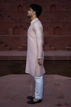 Powder pink satin linen kurta with French knot embroidery on yoke and sleeves. Paired with contrast pant.
Components: 2
Pattern: Embroidered
Type Of Work: Floral
Neckline: Mandarin
Sleeve Type: Full
Fabric: Satin Linen, Chanderi Silk
Color: Pink
Other Details: 
Front buttons
Occasion: Wedding - Aza Fashions Elegant Chanderi Kurta With Embroidered Sleeves, Traditional Formal Kurta With Embroidered Sleeves, Elegant Sherwani With Embroidered Sleeves For Eid, Elegant Eid Sherwani With Embroidered Sleeves, Pink Eid Sets With Embroidered Sleeves, Elegant Chanderi Traditional Wear With Embroidered Sleeves, Eid Cotton Silk Set With Embroidered Sleeves, Festive Sherwani With Embroidered Sleeves For Wedding, Traditional Wedding Sets With Embroidered Sleeves