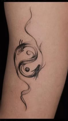 a woman's thigh with a tattoo design on it