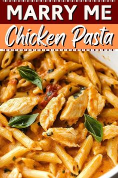 chicken pasta with sauce and herbs in a white bowl