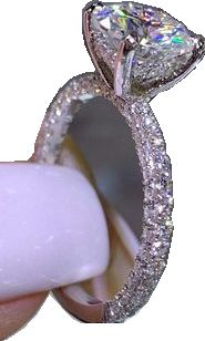 a woman's hand holding an engagement ring with a large diamond on top of it