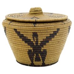 a woven basket with an animal design on the front and side, sitting on a white background