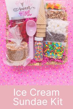 the ice cream sundae kit is packed in a wicker basket with pink sprinkles