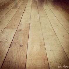 an empty room with wooden floors and hard wood flooring on one side, looking like it could be used as a background