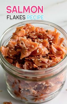 salmon flakes in a glass bowl with sesame seeds on top and the words salmon flakes recipe above it