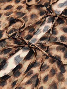 an animal print fabric with a knot at the end