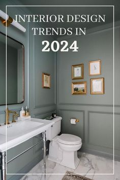 a bathroom with gray walls and white fixtures in the center is an image of a toilet, sink, mirror and framed pictures