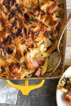 a casserole dish with ham, cheese and spinach