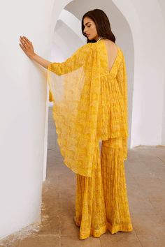 Marigold yellow exaggerated sleeve tunic with all over floral prints, elevated with sequins. Paired with a coordinating sharara. - Aza Fashions Exaggerated Sleeve, Marigold Yellow, Exaggerated Sleeves, Tunic Pattern, Floral Tunic, Print Tunic, Aza Fashion, Fashion Set, Jaipur