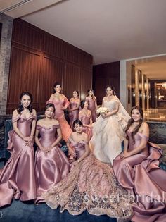 the bridesmaids are posing for a photo in their pink gowns and dresses