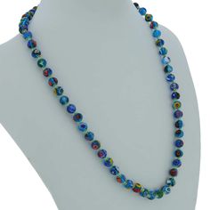 Add a touch of classic Venetian style to your outfit with this elegant Murano millefiori necklace. Centuries-old Murano glass technique perfected by Italian master craftsmen is used to create colorful mosaic effect that is fun and trendy, yet classic and timeless. This is a unique necklace that will add Venetian chic to your jewelry collection and will brighten up your look and your day. Measurements: Each necklace measures 24 inches in length and comes with an attractive velvet pouch and a cert Blue Single Strand Murano Glass Beaded Necklace, Turquoise Round Glass Necklaces, Blue Round Glass Necklaces, Blue Glass Round Necklaces, Blue Single Strand Murano Glass Necklace, Blue Murano Glass Single Strand Necklace, Elegant Blue Murano Glass Necklace, Colorful Mosaic, Blue Mosaic