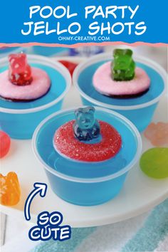 there are four small cups with gummy bears in them on the plate and text overlay reads pool party jello shots