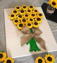 a bouquet of sunflowers sitting on top of a table