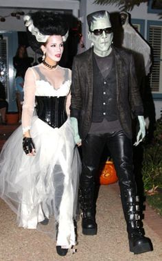 two people dressed up in halloween costumes standing next to each other