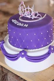 a purple and white cake with a tiara on top