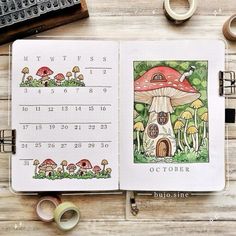 an open notebook with a mushroom house on it