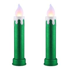 two green candles with white flames on them