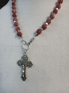 Adjustable Cross Necklace With 8mm Beads, Adjustable Red Cross Necklace, Red Adjustable Cross Necklace, Handmade Spiritual Crucifix Necklaces, Spiritual Crucifix Necklace With 8mm Beads, Spiritual Bronze Crucifix Necklace, Handmade Brown Crucifix Necklace, Spiritual Cross-shaped Gemstone Necklace, Brown Beaded Cross-shaped Rosary