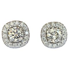 Offered in new condition, a pair of white gold diamond stud earrings set with 2 pieces in the center with a total of 0.80 ct of brilliant cut diamonds of quality H/VS/P1 and surrounded by 28 pieces of brilliant cut diamonds of approx. 0.25 ct G/VS/SI. Total : 1.05 carat Grade: 18 KT (marked 750) Weight: 3.1 grams Size : 9mm*9mm Gold Diamond Stud Earrings, Gold Diamond Earrings Studs, Gold Diamond Studs, Halo Earrings Studs, Gold Halo, Diamond Stud Earrings, Diamond Stud, Stud Earrings Set, Diamond Earrings Studs