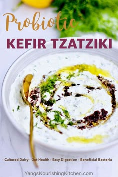 a white bowl filled with greek yogurt and garnished with herbs