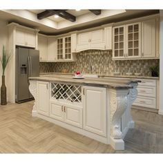 a kitchen with white cabinets and wood floors is featured on the appliance page