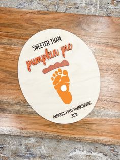 there is a sticker that says sweet than pumpkin pie on the side of a wooden table