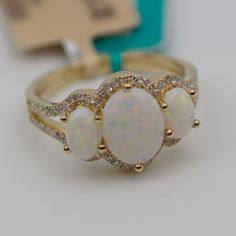 Effy 14k Yellow Gold 3 Stone Oval Opal With Round Diamonds 4.5 Grams Ring Size 7.25 Center Opal 8.5x6.2mm Round White Diamonds This Is A Beautiful New Effy Ring That Showcases These Cute Opals. The Ring Is Stamped And Is Absolutely Brand New With Tags Still Attached. The Retail On This Is $2,624 But You Can Get It For Half Of Retail! If Any Of The Tags Are Removed The Item Is Non Refundable! If You Have Any Questions Or Concerns Please Do Not Hesitate To Ask. Effy Ring, Effy Rings, Opal And Diamond Ring, Effy Jewelry, Ring Size 7, White Diamonds, Womens Jewelry Rings, Diamond White, Round Diamonds