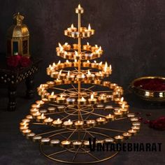 a christmas tree made out of candles on a table