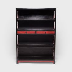 a black and red bookcase with two drawers