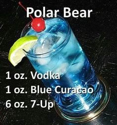 a blue curaco cocktail with a cherry on the top and text that reads polar bear