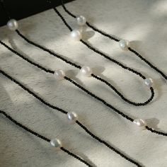 Product Details: Material: 925 silver/black spinel/freshwater pearl (8-9mm) Size: short necklace inner circumference 95cm, long necklace inner circumference 152cm Weight: about 15g/30g Elegant Silver Jewelry With Black Spinel, Minimalist Black Spinel Necklaces, Elegant Beaded Black Spinel Jewelry, Elegant Silver Black Spinel Jewelry, Elegant Silver Black Spinel Necklace, Black Agate Necklace, Geometric Type, Long Necklaces, Gemstone Beaded Necklace