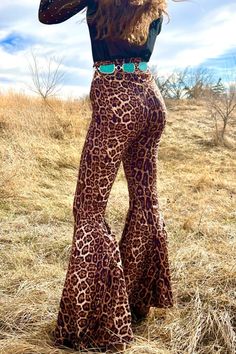 Long Live Leopard Bells Feel beautiful in a pair of Long Live Leopard Bells! Our high-waisted design accentuates your curves and flatters your figure, providing an all-day confidence boost that'll make you feel unstoppable. Step out with style and grace in these must-have leopard print bell bottoms! Pull on, no zippers, elastic waistband. VERY STRETCHY! Models are wearing an XS and an XL. True to size. 92% Polyester/ 8% Spandex Size Fits XS 0 Small 2/4 Medium 6/8 Large 10/12 XL 14/16 2X 18/20 3X Printed Bell Bottoms, Bell Bottoms Outfit, Vintage Leopard, Flared Trousers, Bell Bottom Pants, Flare Trousers, Confidence Boost, Feel Beautiful, Style And Grace