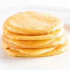 a stack of cookies sitting on top of a white plate