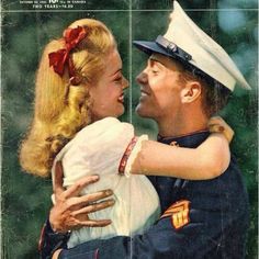 an old photo of a man in uniform hugging a woman's face with both hands