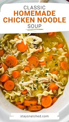 chicken noodle soup with carrots and noodles in a white bowl