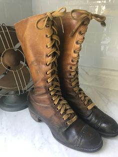 "Fabulous historical boots! Very small shoe size (possibly children's) on a boot that tells a story.  In my research, I found nothing exact and few that came close. This is truly a rare vintage find!  Consider these boots are more than 100 years old! Remarkable condition for the age of the boot.  Some sites claimed that these were Girl Scout boots, while others claimed Hiking Boots. Either way - they're pretty sweet!  Difficult to measure - I was unable to retrieve the inside measurements. Pictu Tall Lace Up Boots, Fishing Boots, Old Boots, Old Shoes, Hiking Boots Women, Vintage Boots, Girl Scout, Two Piece Dress, Hiking Shoes