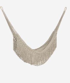 an image of a hammock hanging from the ceiling with fringes on it