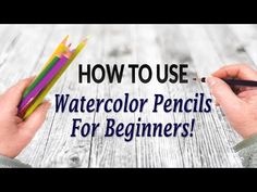 two hands holding pencils with the words how to use watercolor pencils for beginners