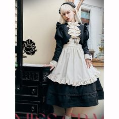 An embroidered dress, short jacket, and strap apron that will make you look like a butler's daughter with a mysterious atmosphere. The front of the dress is decorated with cross-shaped embroidery, and the jacket has bulges around the shoulders and is decorated with ruffles. An elegant item with a high waist and wide hem. 
 
 
 
 Scheduled delivery 
 
 This is a pre-order item. 
 It will take about 2 to 3 months from order to delivery. 
 
 
 Item 
 
 3-piece set of dress + short jacket (with jabo Elegant Cotton Victorian Dress For Costume, Cotton Victorian Dress For Dressmaking, Spring Cosplay Dress With Doll Collar, Fitted Doll Collar Dress For Cosplay, Long Sleeve Victorian Dress For Cosplay, Gothic Cotton Dress With Ruffles, Vintage Doll Collar Dress For Cosplay, Gothic Doll Collar Costume Dress, Gothic Doll Collar Dress For Costumes