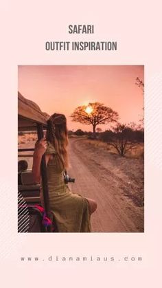 two women sitting on the back of a car looking out into the distance at sunset