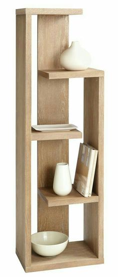 a wooden shelf filled with books and bowls