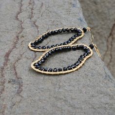 The abstract shapes in our freestyle collection are each completely unique.- Black spinel gemstones- 2 1/2" long- French hooks- 14k gold plated .925 fine Italian sterling silver- Made in the USA in our NYC studio- Packaged in a gift box- Free shipping on US ordersHandmade to last. Our unique gold plating technique makes our jewelry tarnish resistant. The nature of natural gemstones makes each style one-of-a-kind. Black Statement Earrings, Nyc Studio, Spinel Gemstone, Gold Statement Earrings, Garnet Earrings, Black Spinel, Birthday Jewelry Gift, Gemstone Necklace Pendant, Earrings Black