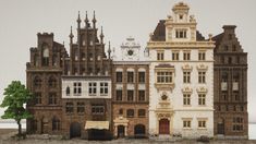 an old building with many windows and some trees in front of it on the ground