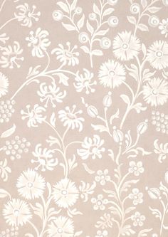 a beige and white wallpaper with flowers on it