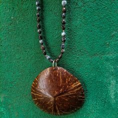 Seeds necklace | Jobs tears necklace | Coix lacryma – jobi seeds | Jobs tears necklace with coco pendant | coconut shell pendant Handmade Brown Shell Necklace For Gift, Fair Trade Brown Necklace For Gift, Brown Fair Trade Necklace Gift, Handmade Brown Teardrop Pendant Necklace, Adjustable Handmade Brown Shell Necklace, Unique Brown Fair Trade Necklace, Coconut Jewelry Handmade, Unique Brown Teardrop Necklace, Coconut Shell Pendant