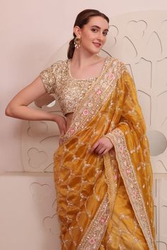 Yellow organza saree with floral, thread and sequins hand embroidery. Comes with a padded blouse. - Aza Fashions Designer Organza Pre-draped Saree With Dori Work, Gold Organza Pre-draped Saree For Navratri, Festival Organza Pre-draped Saree With Mirror Work, Gold Organza Pre-draped Saree With Resham Embroidery, Designer Organza Pre-draped Saree For Festivals, Fitted Embroidered Organza Fabric For Saree, Festive Organza Pre-draped Saree With Pallu, Bollywood Style Festive Organza Blouse Piece, Traditional Pre-draped Organza Saree With Mirror Work