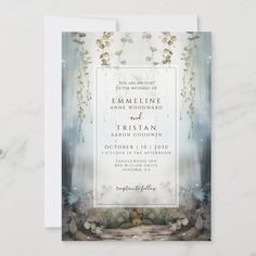 a wedding card with an image of flowers and leaves in the background, on a marble surface