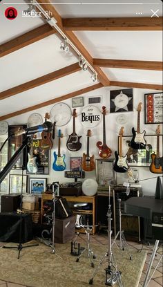 a room filled with guitars and musical equipment