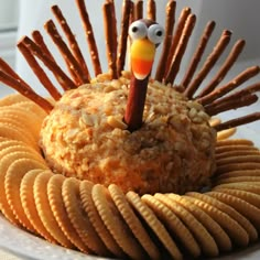 a plate with crackers, crackers and a fake turkey on top of it